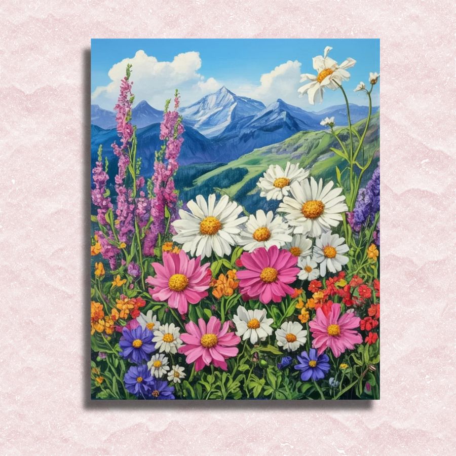 Canvas print of a colorful floral scene with mountains in the background on a textured pink surface. Alpine Wildflowers - Paint by numbers