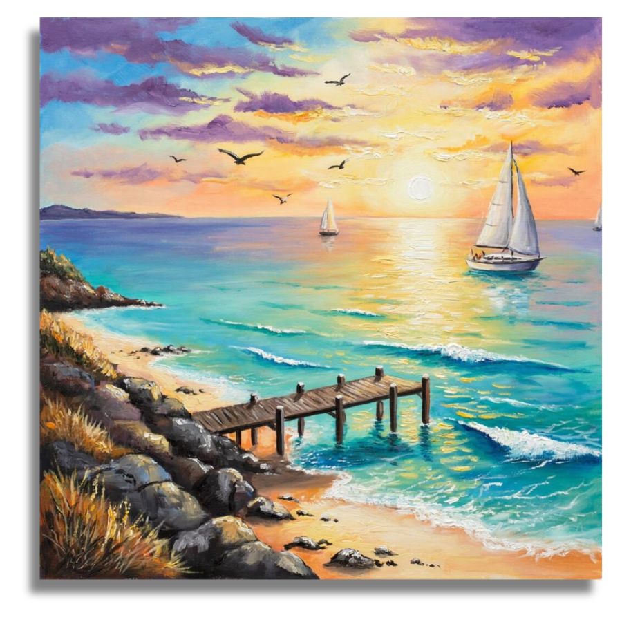 A square canvas painting of a coastal seascape at sunset, showing turquoise ocean water, a sandy beach, rocky shoreline, a wooden dock, sailboats on the water, and birds in a colorful sky with purple, blue, orange, and yellow tones. Mini Coastal Pier - Paint by numbers