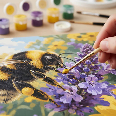 Person painting a bumblebee on flowers with paint by numbers