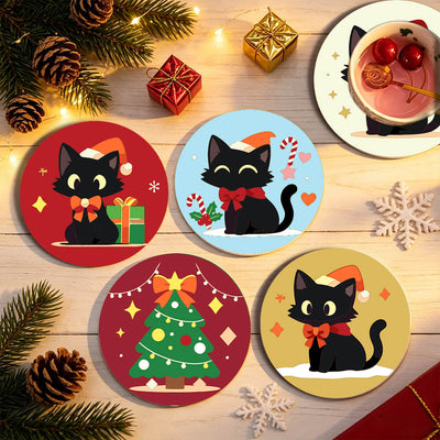 Four round Christmas-themed coasters featuring cute black cat illustrations in holiday outfits, arranged on a light wood surface with pine branches, ornaments, gift boxes, and a cup of mulled wine nearby. Christmas Kitties Coasters - 6 Pack Paint by Numbers Lifestyle