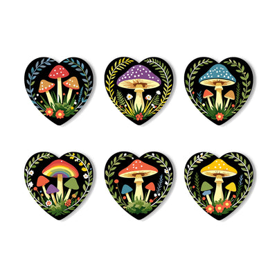 Six heart-shaped decorative stickers or magnets featuring colorful illustrated mushrooms on a black background, arranged in two rows of three on a white background. Enchanted Mushrooms Coasters - 6 Pack Paint by Numbers