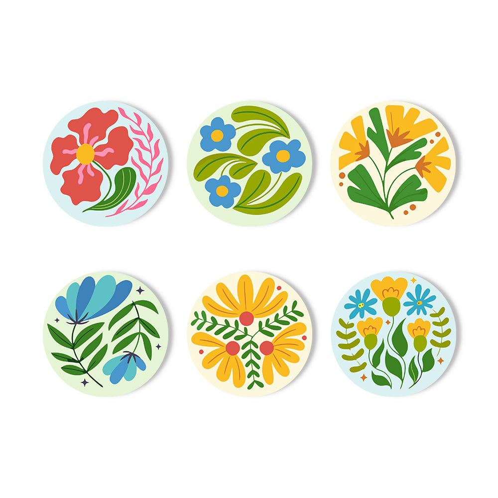 Six circular stickers with colorful folk-art floral designs arranged in two rows of three on a white background. Modern Wildflowers Coasters - 6 Pack Paint by Numbers