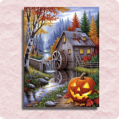 Serene Autumn Mill - Paint by numbers - Painting of a forest scene with a watermill and glowing jack-o'-lantern on a pink textured background.