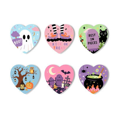 Six heart-shaped Halloween-themed stickers arranged in a 2x3 grid on a white background. The designs include a ghost with a 'BOO!' sign, witch legs at 'RICK OR TREAT', a black cat over a tombstone reading 'REST IN PIECES', a spooky tree with an owl and pumpkin, a graveyard with tombstones and bats, and a black cauldron with a potion mixture. Spooky Hearts - Coasters Paint by numbers