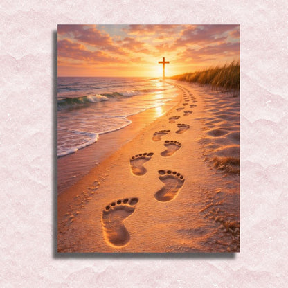 Footprints in the sand leading to a cross on a beach at sunset. Walking by Faith - Paint by numbers